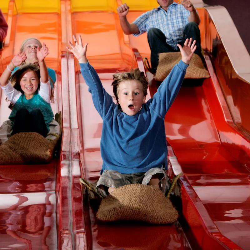 Children having fun on the helter skelter at The Milky Way